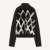 Rollkragenpullover aus Wolle und Leder mit Intarsien