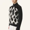 Rollkragenpullover aus Wolle und Leder mit Intarsien