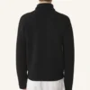 Rollkragenpullover aus Wolle und Leder mit Intarsien