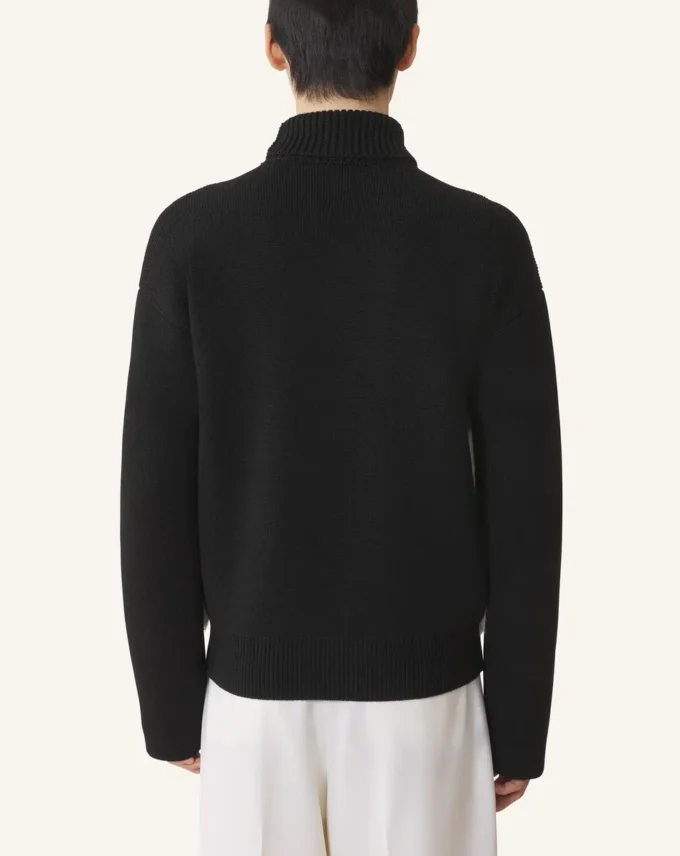 Rollkragenpullover aus Wolle und Leder mit Intarsien
